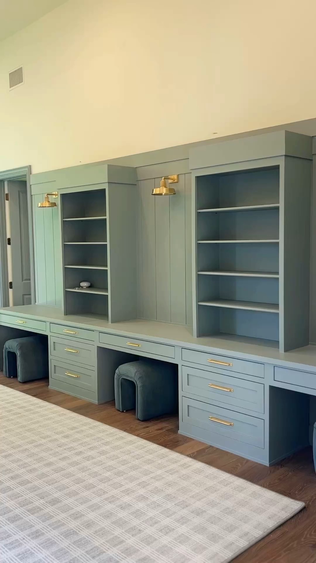 Homeschool Room details including light fixtures and ottomans. Paint color is BEHR “Dusk Blue."