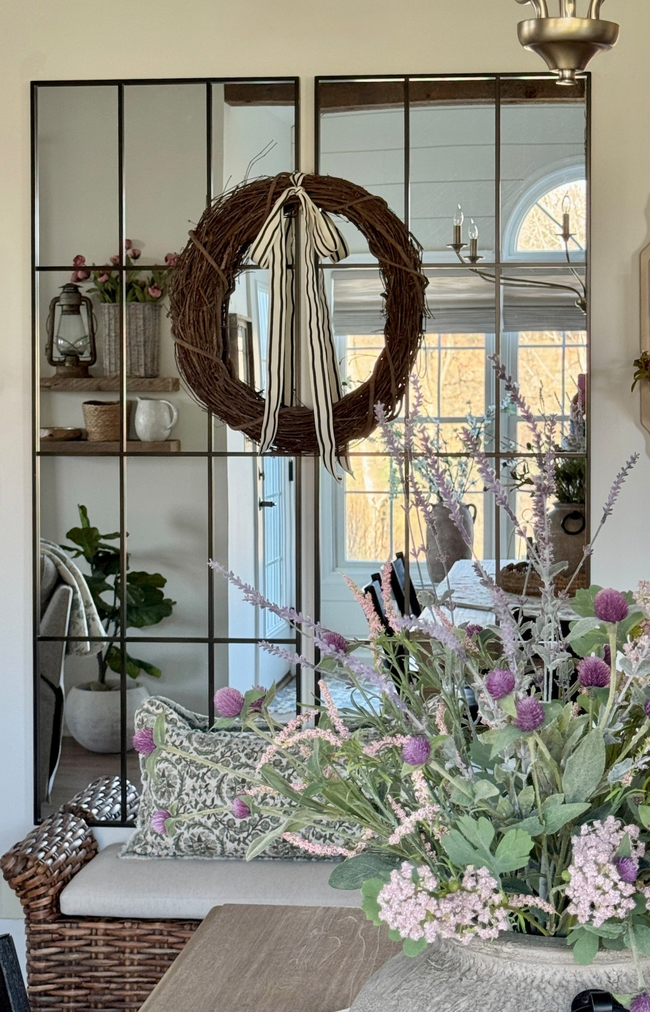 Long narrow window pane wall mirrors (I used two here.) Stylish upholstered bench with cushion. Grapevine wreath. Striped ribbon. Long lumbar pillow. Reclaimed wood shelves. 6 light brushed gold chandelier. Faux florals  

#LTKHome