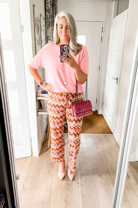 Full outfit is Norah and cannot be linked. Pink knitted shirt sleeve sweater paired with chevron print jersey pants and nude heels. Pink velvet purse. 



#LTKmidsize #LTKover40 #LTKstyletip