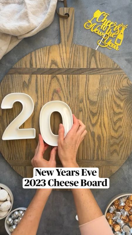 New Year’s Eve 2023 Cheese Board

1. Use your 2023 serving bowls and fill with chocolate kisses and blueberries. 
2. Fan out your cheese slices and pile your cubes.
3. Fill in empty spaces with crackers, fruits, and meat.
4. Top off with rosemary and enjoy!

✨PART 2✨ NYE IDEAS.
I got these cute number ramekins off Amazon. The 2’s are currently sold out, but you can always shape Hershey kisses (or other candy) into numbers without. There’s also some alternatives I’ll post in highlights. PS- if you have a bday coming up, these numbers are great for a bday charcuterie Board. Or a graduation party.

#ainttooproudtocheese #cheeseboardingschool #feedfeed #food52 #imsomartha #charcuterieboard #thatcheeseplate #amazonfinds

#LTKHoliday #LTKSeasonal #LTKhome