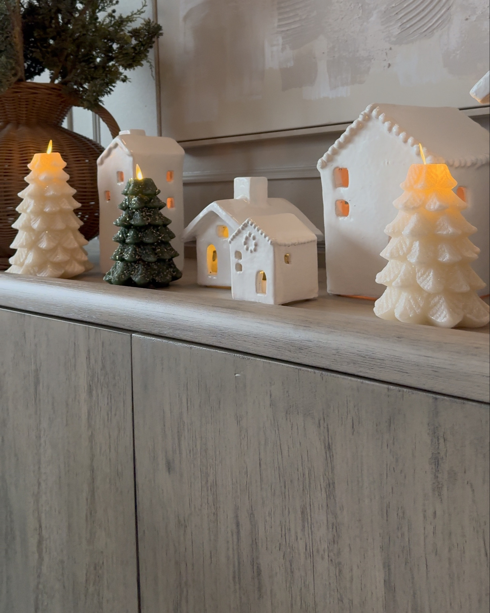 The prettiest led wax Christmas tree candles paired with neutral ceramic village houses 

#LTKSeasonal #LTKHome #LTKFindsUnder100