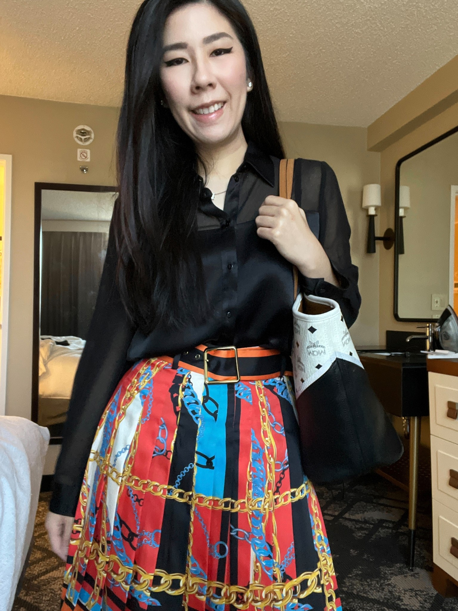Fall is here which means spooky season is right around the corner! To kick off the festivities, I’m incorporating black and orange into my wardrobe. I paired a sheer inlet satin collar button down with a pleated printed mini skirt for work. 

#pleatedskirt #satintop 

#LTKPetite #LTKWorkwear #LTKStyleTip