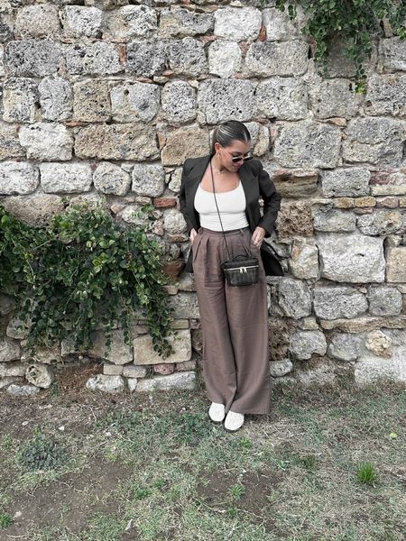 Revolve 
Trousers 
Brown trousers 
Adidas sambas 
Outfit of the day 
Fall outfit inspo 
Florence Italy 
Europe trip outfits 
Skims tank 
Revolve favorites 
Revolve finds 
