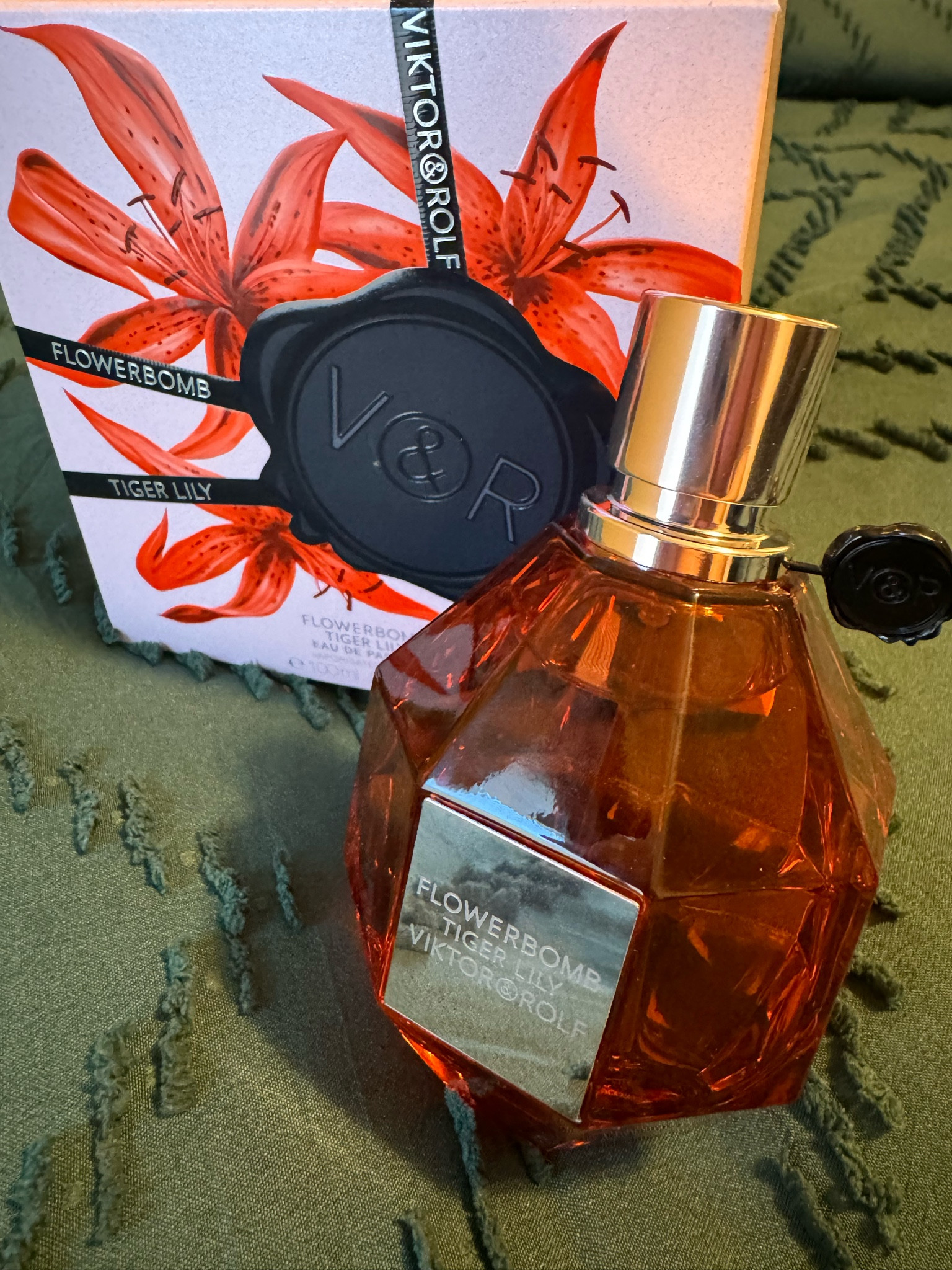 I’m not particularly into Victor and Rolf’s FlowerBomb so I was surprised that I liked this TigerLily variation.

The instantly recognizable FlowerBomb grenade fragrance bottle displays the amber hue of the perfume.

It’s a sensual, tropical scent with coconut milk, mango, and wild floral tiger lily.
