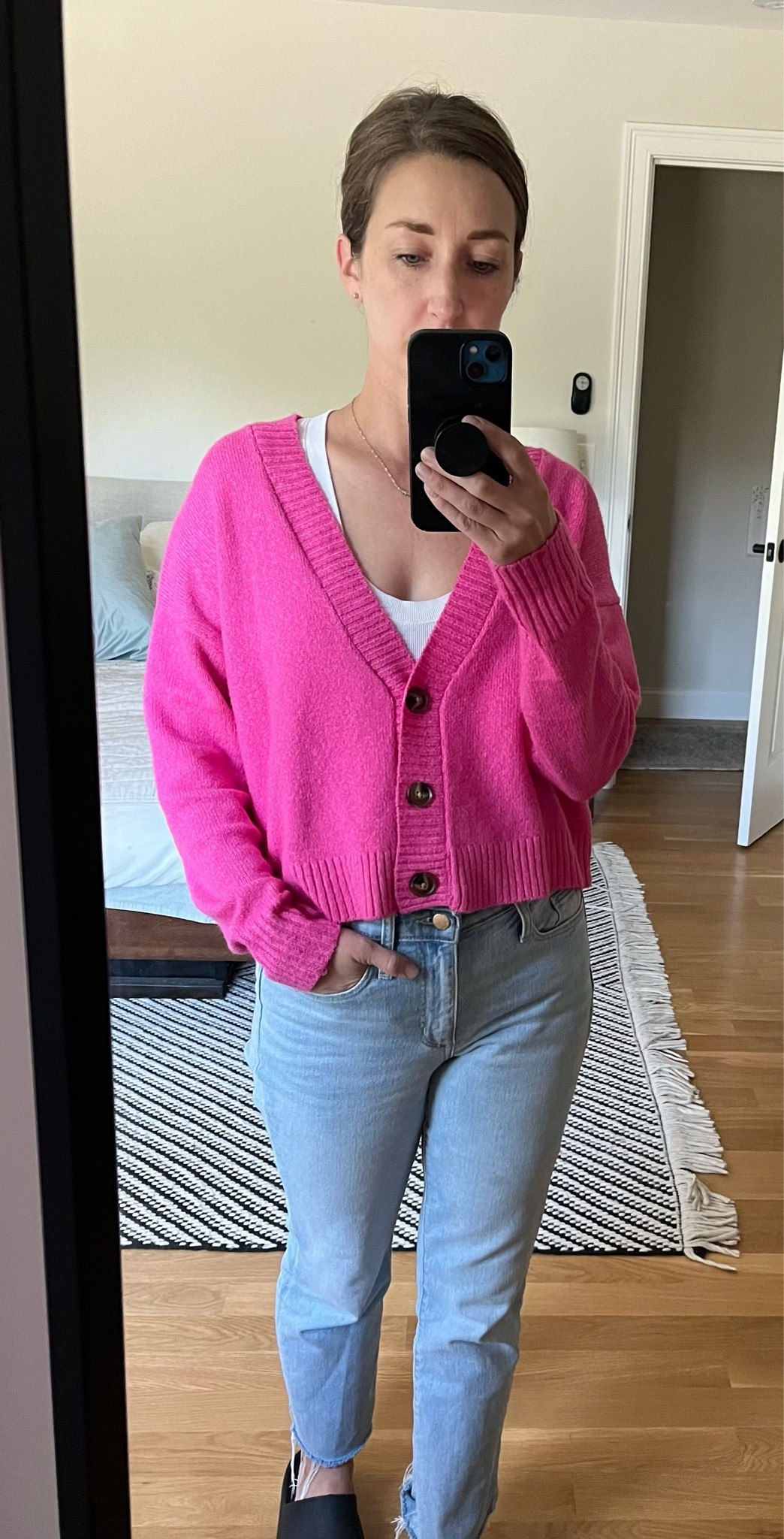 Pink cropped sweater with high waisted boot cut jeans 

#LTKstyletip #LTKfindsunder50