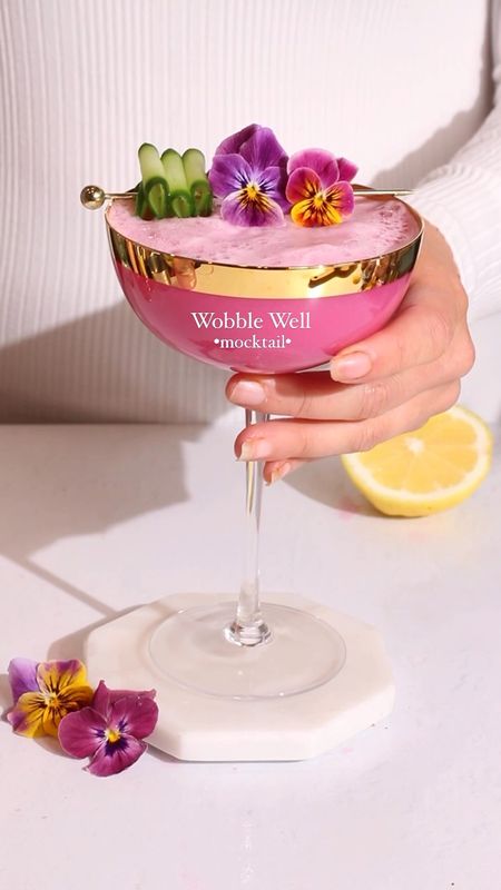 Make this Wobble Well mocktail recipe in minutes in the comfort of your kitchen. I used my favorite gold rim coupe glasses for this recipe! 