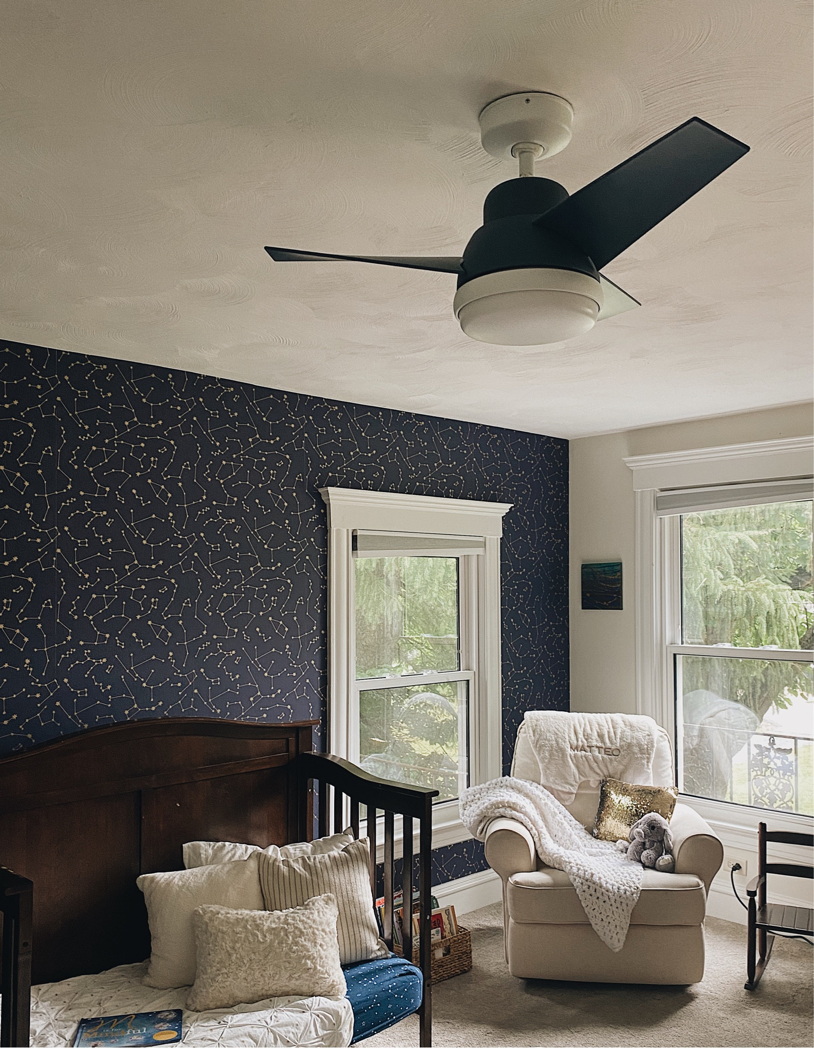 Part I of our son’s big boy room transformation - update the light fixture! 
This ceiling fan from Hunter Fan Company is absolutely adorable and works great! It comes in three colors - Indigo blue (pictured here), blush pink and dove gray, has three speeds and a light with dimmer that’s easily operated by a remote control. This is my SIXTH Hunter Fan Co light fixture and second ceiling fan. I cannot say enough about this century-old company! 

#LTKHome #LTKKids #LTKSaleAlert