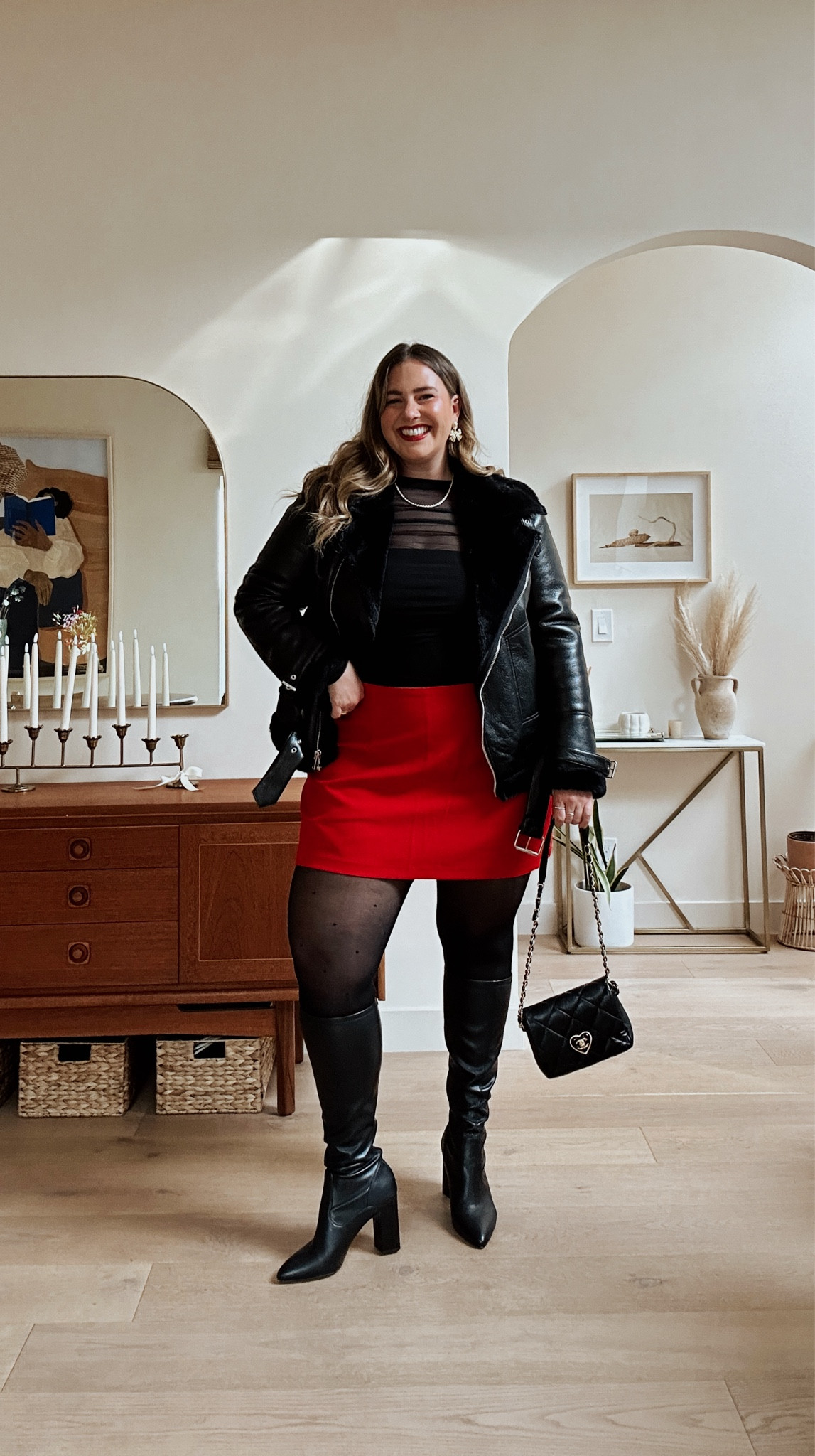 Styling the viral red skort for the holidays! 🎁♥️✨

Skort: XXL but really needed the XL… this one is a bit big but also very comfy haha — it’s almost sold out so I did link some similar options!

Bodysuit: XL could have also worn a L bc it has good stretch! Currently 20% off!

Tights: they are truly the best tights in the world. I can’t link on LTK but they are from Sheertex and I’m an XL.

Jacket: mine is old so linking similar!

Boots: TTS, perfect for wide calf (my calf is 17 inches and they are on sale!

#LTKparties #LTKmidsize #LTKHoliday