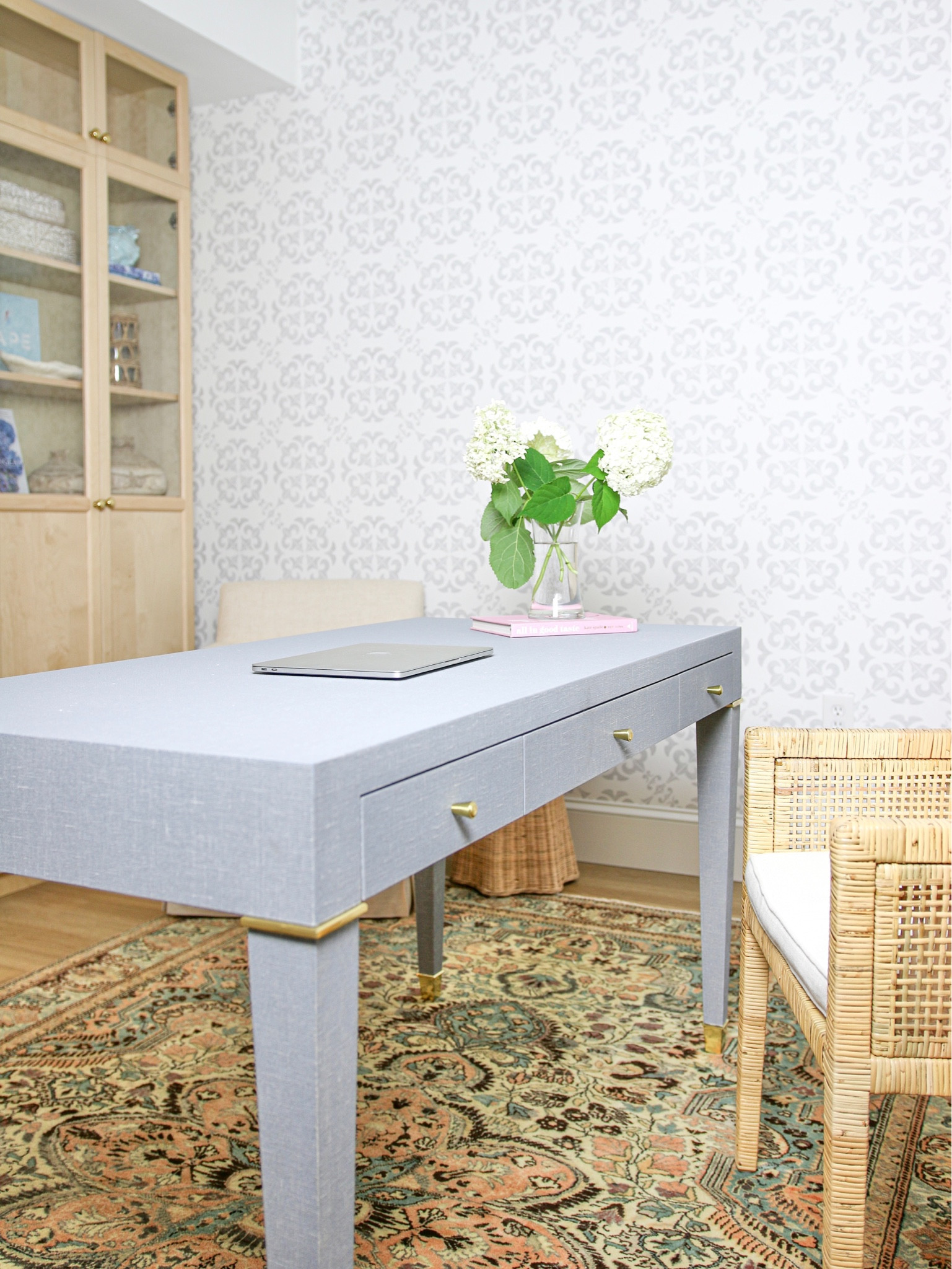 Here is a look at the other side of the office. Along with the linen wrapped desk and rattan armchair I used IKEA bookcases to create this space. You cannot see it here but I used strip lights in the bookcases

#LTKstyletip #LTKhome #LTKFind