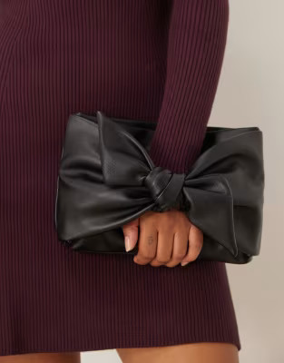 ASOS DESIGN large bow front clutch bag in black | ASOS (Global)