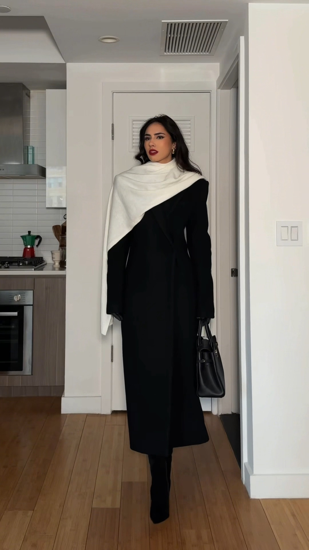 Wrapped in warmth, but keeping it chic. How do you style your scarf, simple, tucked, or draped?🖤 #LTKStyle

#LTKSeasonal #LTKootd