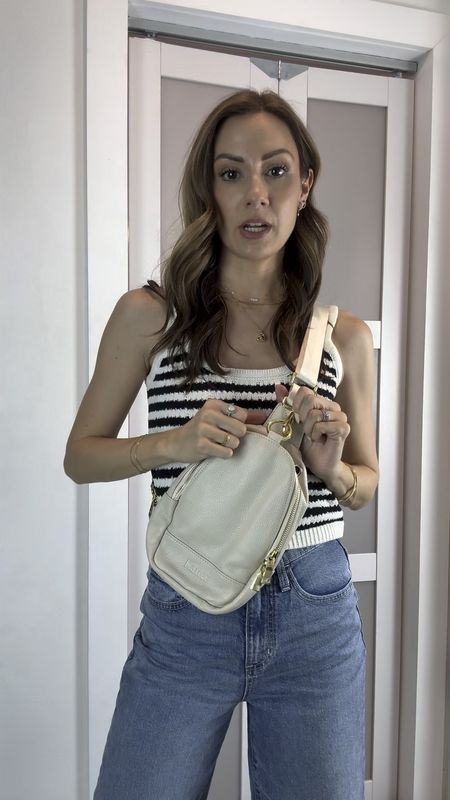 Use code MICHELLE020 for 20% off the crossbody handbag! I have a reel and more stories coming with this crossbody but I can’t wait to share it because it’s so good! It’s a soft, genuine leather, it fits sooooo much, it has a hole for your headset wire, secure closure, and you can switch the hook to wear in the front or the back! It comes in lots of colors! For my outfit, I’m wearing a small in the sweater tank and a 00 in the jeans, which I have two pair of because I love them! One I left long and these I cut at ankle length!

#LTKFindsUnder50 #LTKItBag #LTKTravel
