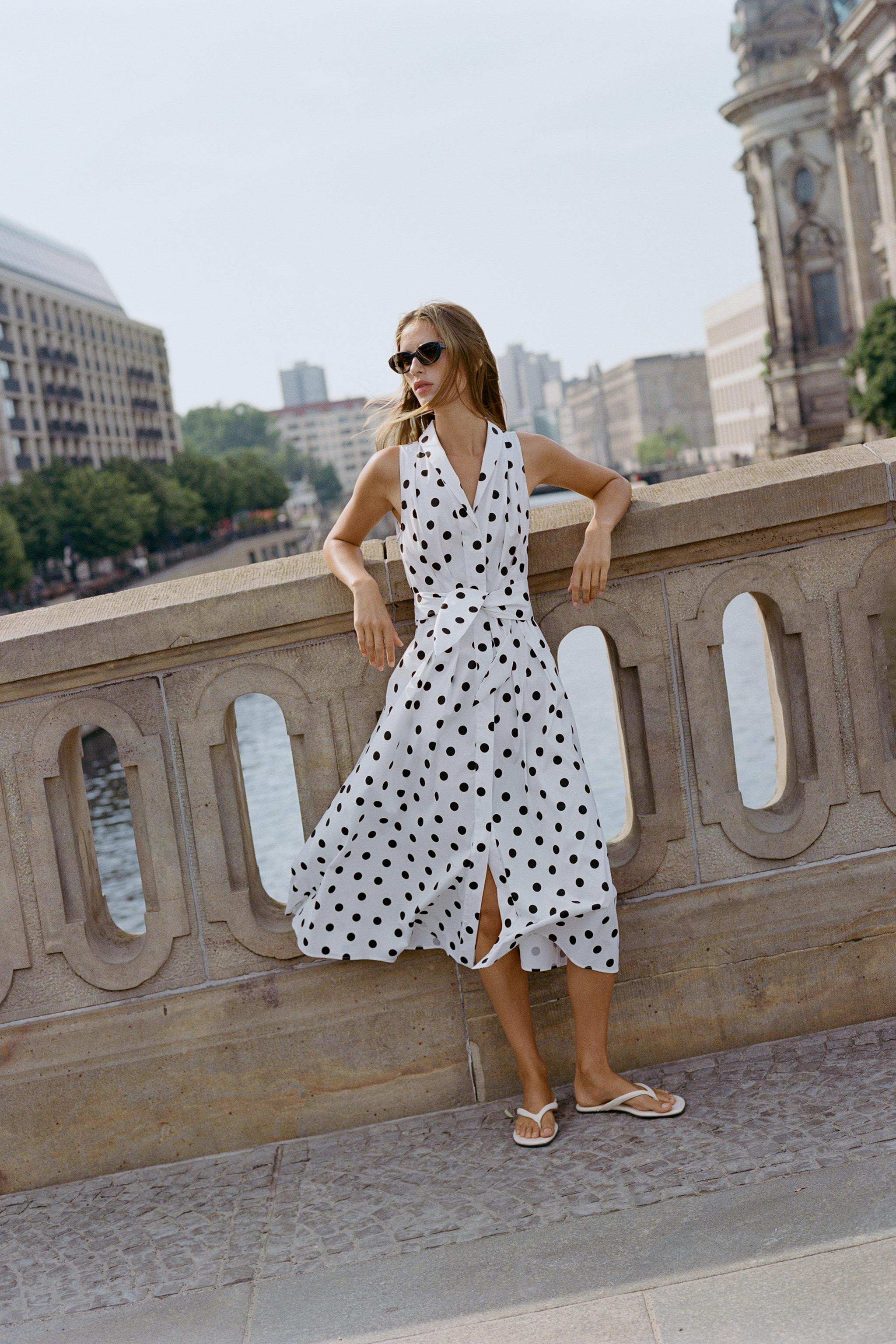 Midi dress with a lapel collar, V-neckline, and sleeveless design. Features waist darts and a mat... | Zara US