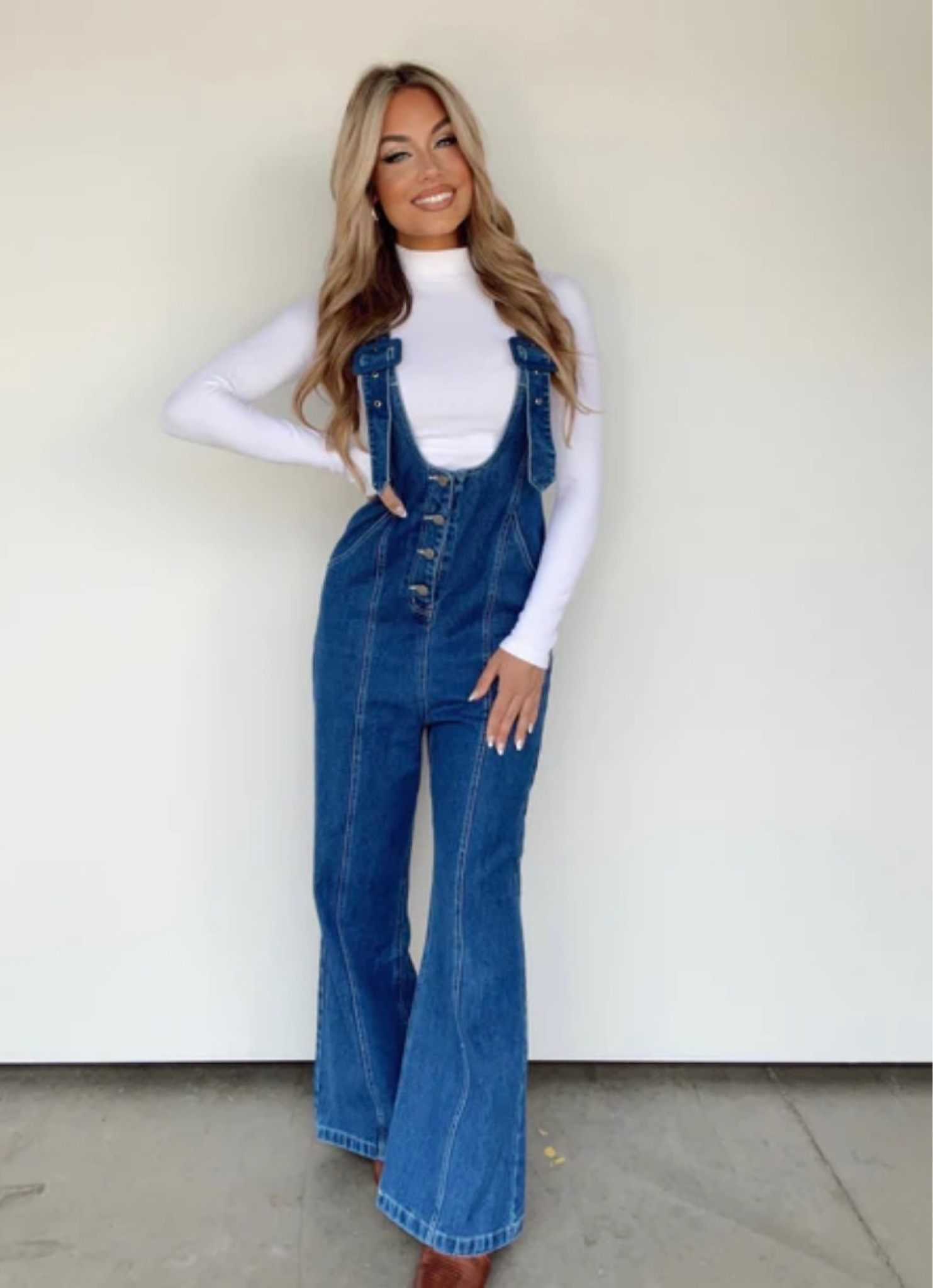 This Overall Chic Jumpsuit is a stylish transition piece perfect for all your fall activities. Crafted with denim in a luxe dark wash, featuring buckle straps, a scoop neckline, and button and seam details, it has all the essential elements of elevated style. The criss cross strap detail adds a touch of trend, making it the perfect statement piece for an apple picking outing, pumpkin patch trip, shopping spree, or brunch date.

#LTKSeasonal #LTKbeauty #LTKstyletip
