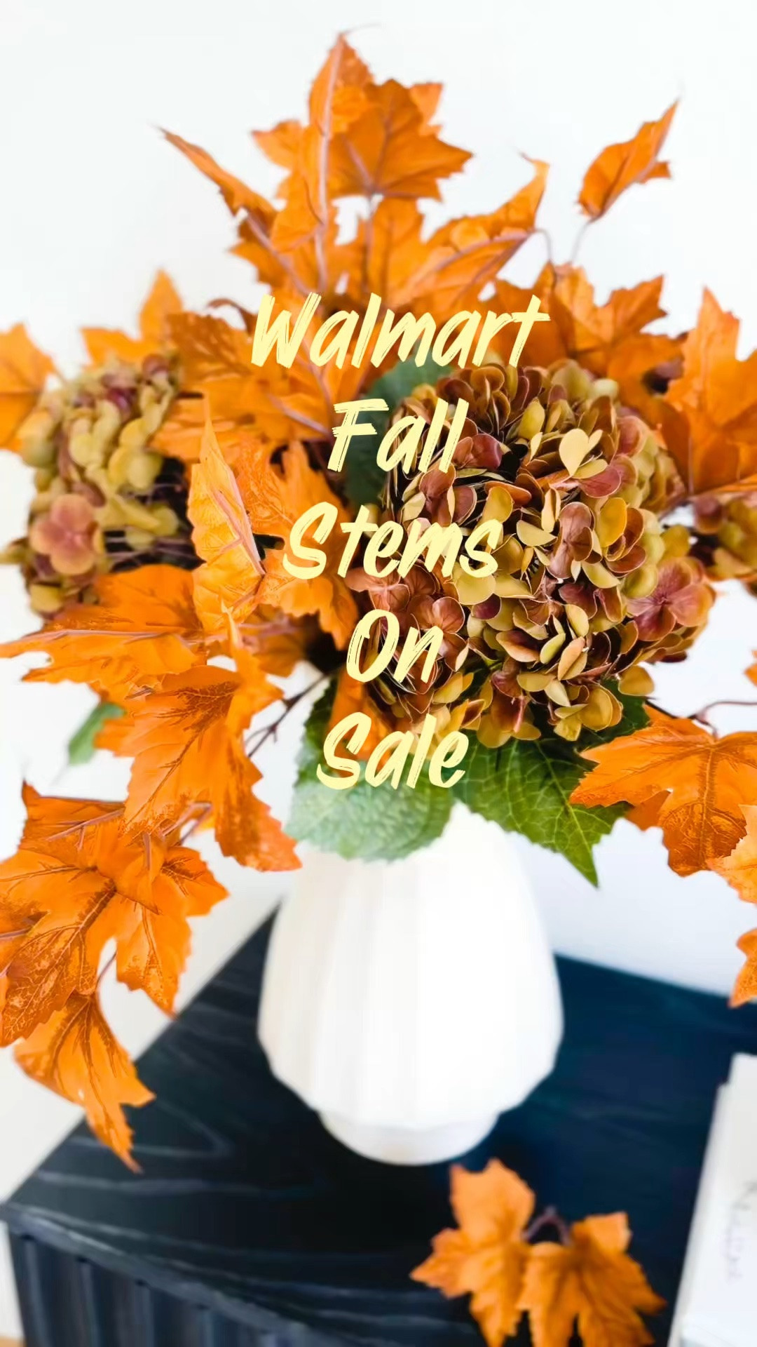 Fall floral arrangement ideas for a cozy autumn home! 🍂 These gorgeous orange fall oak stems are on MAJOR SALE right now, and they are perfect for creating a beautiful, full fall floral arrangement without spending a fortune!

I mixed the vibrant autumn oak leaf branches with warm, muted faux hydrangeas in a textured neutral vase for an easy fall home decor look. I love how the orange leaves bring in those rich fall colors while still working beautifully with neutral, modern home decor.

This is such an easy way to style a console table, entryway table, living room cabinet, dining table, or fall centerpiece. Add a few stacked coffee table books and a cozy candle for simple seasonal decorating that feels warm, elevated, and inviting.

If you’re looking for affordable fall decor, realistic faux fall stems, autumn flower arrangement ideas, or neutral fall home decorating inspiration, this is one of my favorite combinations!

🍁 Oak leaf stems are on MAJOR SALE!
🤎 Shop the fall stems, hydrangeas, vase, and styling details linked here.

#FallHomeDecor #FallFloralArrangement #FallDecorIdeas #AutumnDecor #ConsoleTableStyling