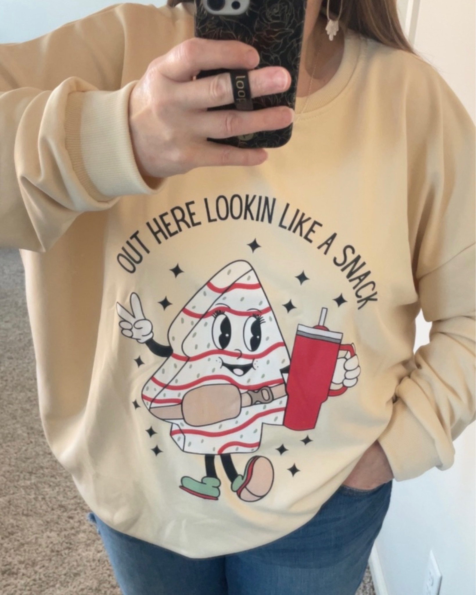 This Christmas shirt is so me! It’s got the Little Debbie Christmas Tree Cake. It’s got the water cup. It’s got the belt bag. It’s perfect! 

I sized up according to the size chart but I shouldn’t have. Maybe go one size up if you want it oversized  

#LTKGiftGuide #LTKHoliday #LTKSeasonal