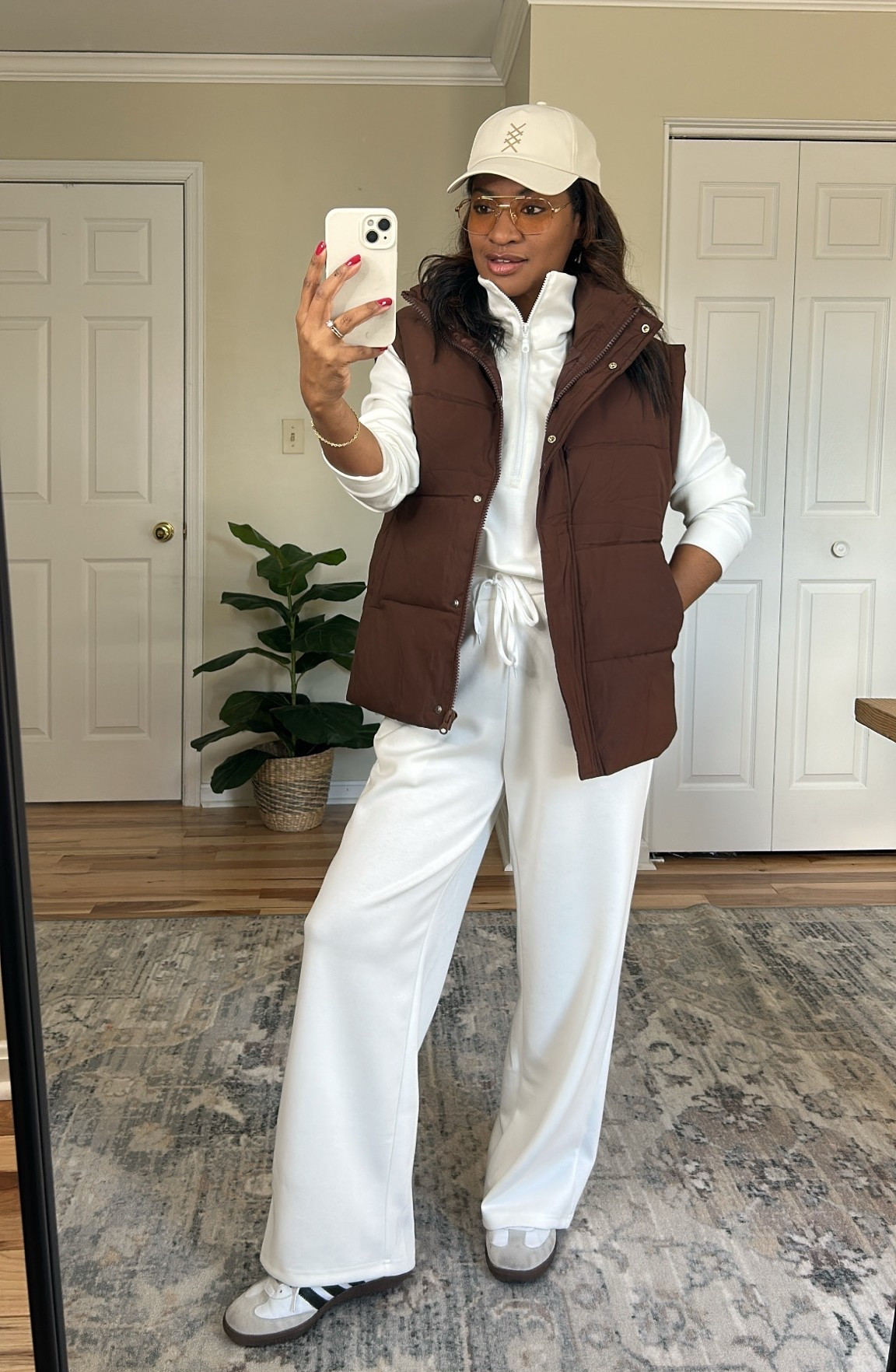 I am wearing a size medium, and the vest and a size medium in the white set. Size down 1/2 in the shoes. ￼