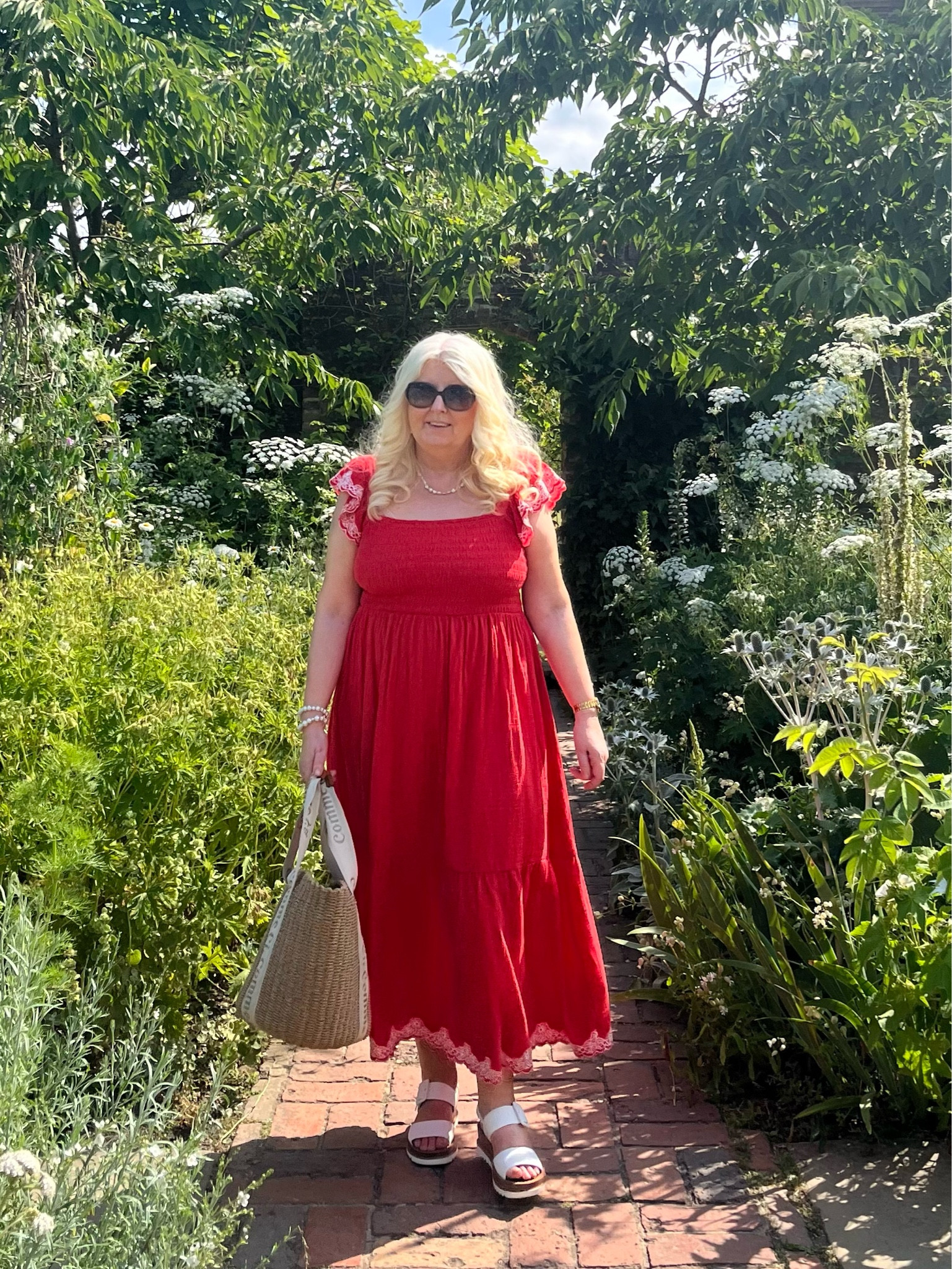 Red floral embroidered sleeve tiered midi dress and basket bag 

#LTKstyletip #LTKeurope #LTKSeasonal