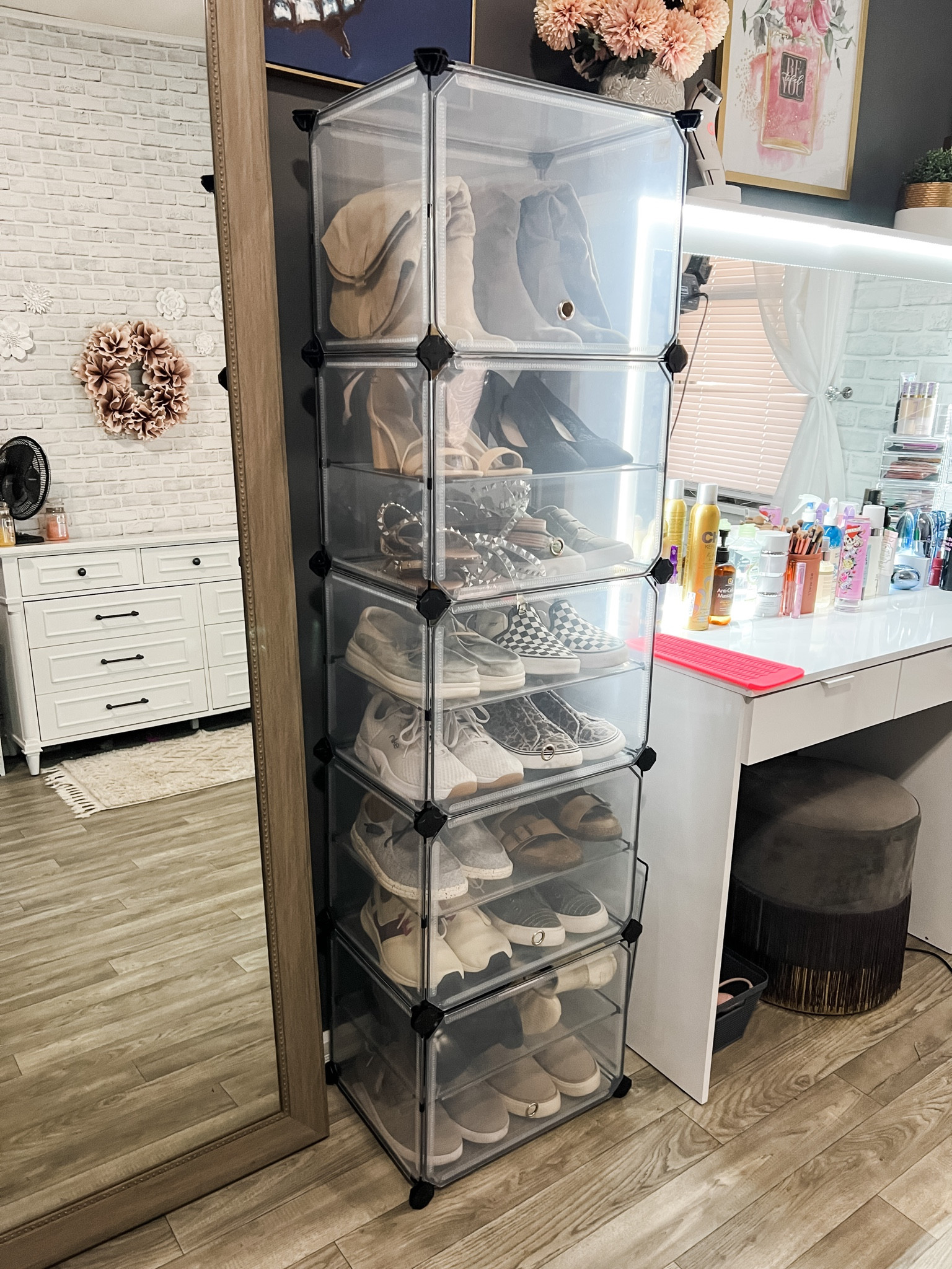 Got my new shoe rack in and love it! I wanted something enclosed (because I have a new puppy..enough said 🤣) and came across this one. You can configure it to different shapes too, but I just did a tower. My 13 year old put it together so not hard to do at all! Granted I need another one for the rest of my shoes 🤣, but it holds 20ish pairs! I left the shelf in the top cube off so that I could put my boots there. Highly recommend! The fronts lift open easily too. There’s 2 other color options if you don’t want the transparent. 