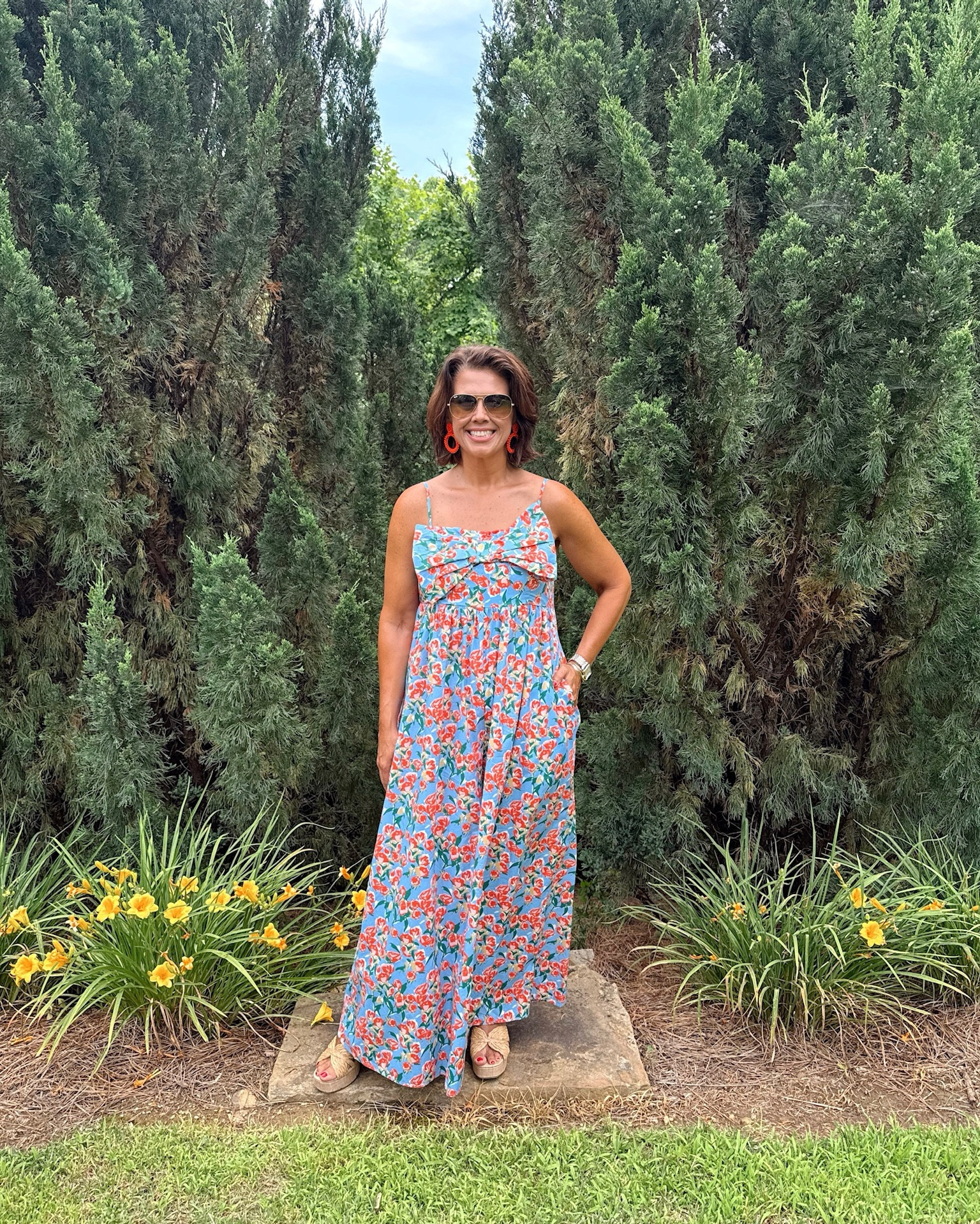Floral print romper with oversized bow and adjustable straps. Looks like a dress - but it’s a romper! 🧡🌸

Sis is wearing a size Large. Could size down if between sizes  

#LTKStyleTip #LTKSummerEdit #LTKTravel