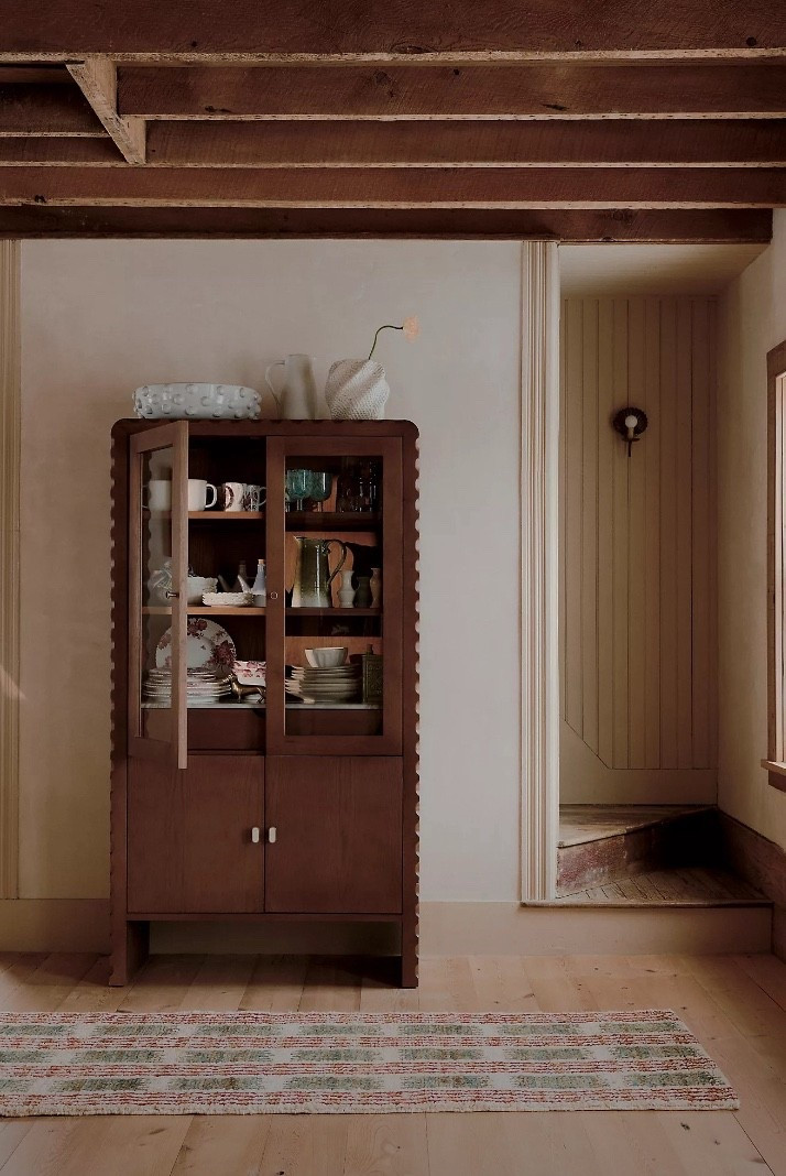 This marble-top wood hutch means business. Warm wood, pretty scalloped edges, and glass doors to show off the good china you never actually use 😂 

This wooden hutch from Anthropologie is truly one-of-a-kind. 

Wood cabinet, living room furniture, home accents, wooden cabinets, Anthropologie furniture, unique home finds, china hutch, living room organization, storage solutions 

#LTKStyleTip #LTKHome #LTKFamily