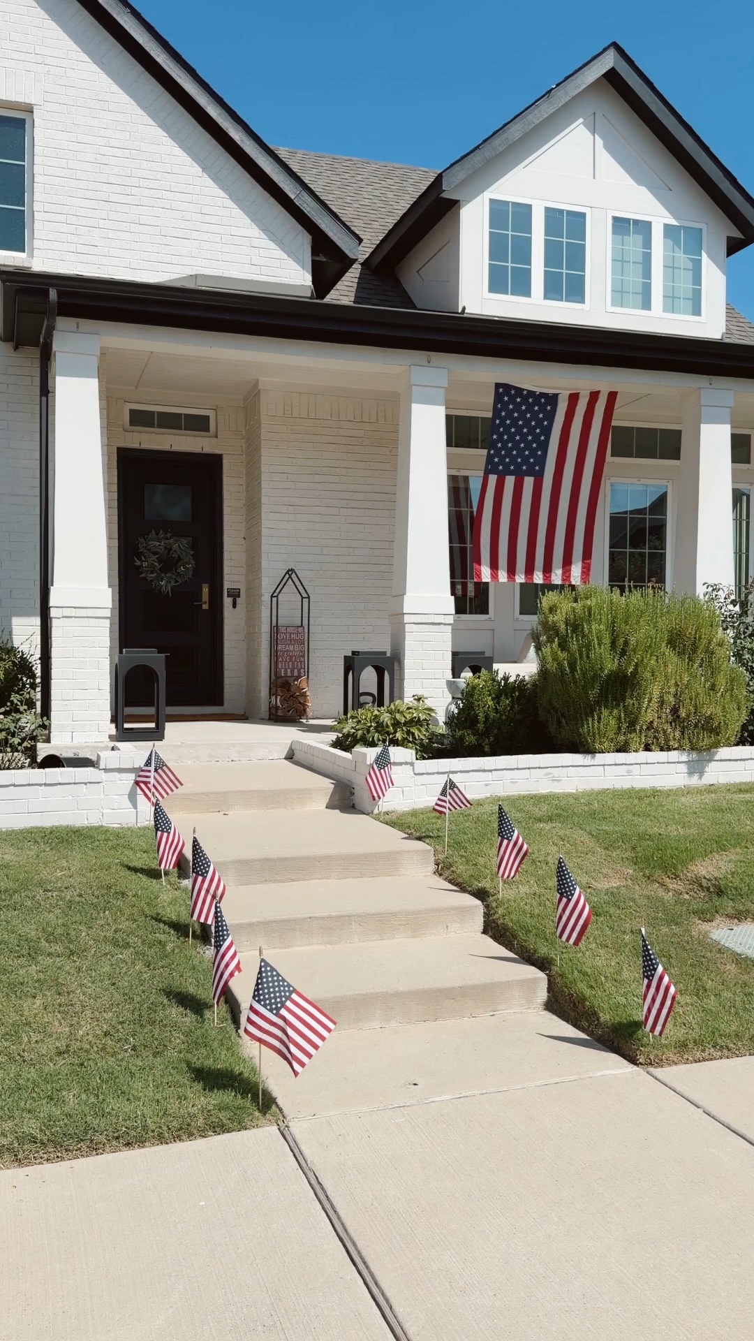 Fourth of July decor with American flags for our front porch and front of the house! Love these flags and you can use a screwdriver to make the hole before putting the flags in.

#LTKHome