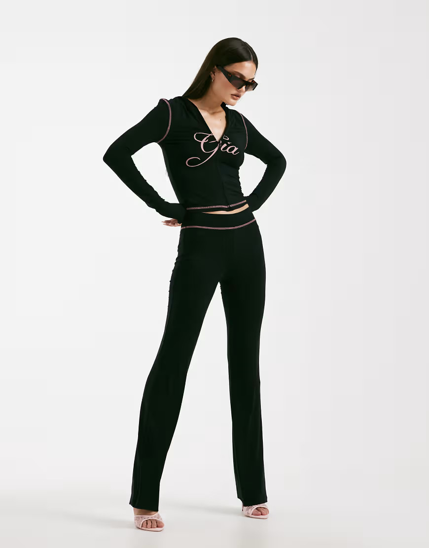 I.AM.GIA Blare logo back print contrast stitch track pant co-ord in black and pink | ASOS (Global)