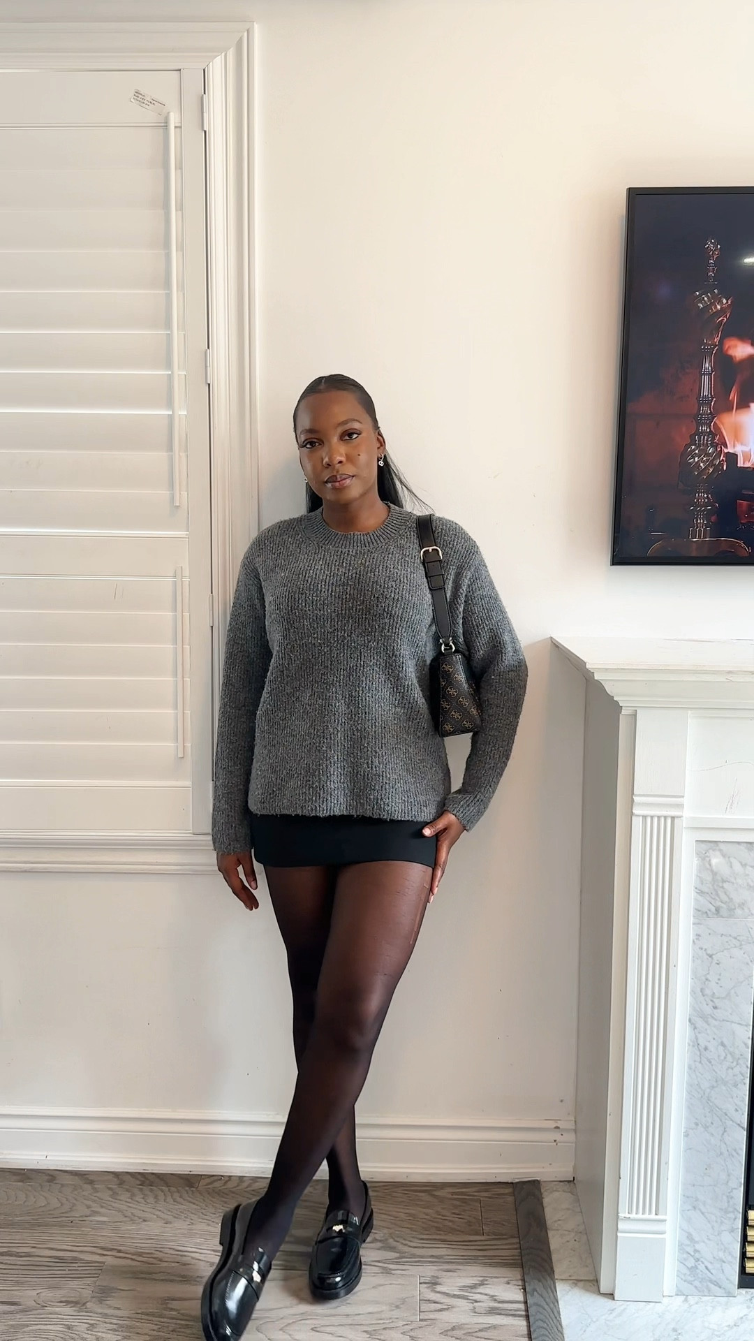 Black short skirt, grey sweater, loafers 

#LTKcanada