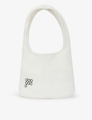 Brand-embossed recycled and organic cotton-blend shoulder bag | Selfridges