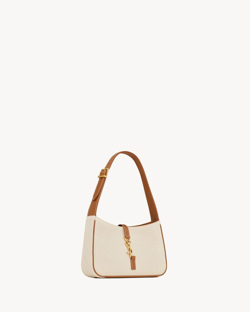 Hobo bag featuring leather tab with THE CASSANDRE and tonal suede lining. Compact and SPACIOUS, i... | Saint Laurent Inc. (Global)