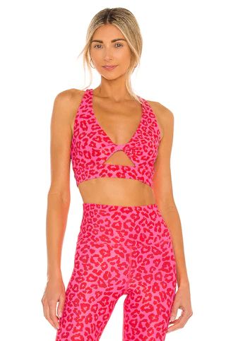 BEACH RIOT Twist Sports Bra in Famous High Risk Red Leopard from Revolve.com | Revolve Clothing (Global)