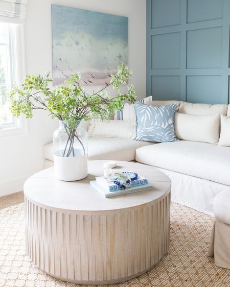 Loved the coastal vibes of the den in our last house. Items include a large beach print, a striped pillow, a palm pillow, a textured lumbar pillow, a colorblock vase with faux greenery. Additional items include a round wooden coffee table, a jute area rug and a slip-covered sectional. Items not shown include a tripod lamp, a scalloped flush mount light, a decorative wood ladder and fabric roman shades. 

simple decor, target threshold, coastal decor, neutral decor, coastal decorating, coastal design, den, family room, living room area rug, pottery barn coffee table, target home décor, den rugs, serena and lily rugs, rugs family room, serena and lily pillows, living room inspiration, game room, media room, wall art, serena and lily, pottery barn sofa, wall decor, coffee table decor, family room decor, amazon finds, target finds, coastal inspiration #ltkfind 

#LTKSeasonal #LTKstyletip #LTKunder50 #LTKunder100 #LTKsalealert #LTKhome #LTKfamily #LTKstyletip #LTKFind #LTKhome