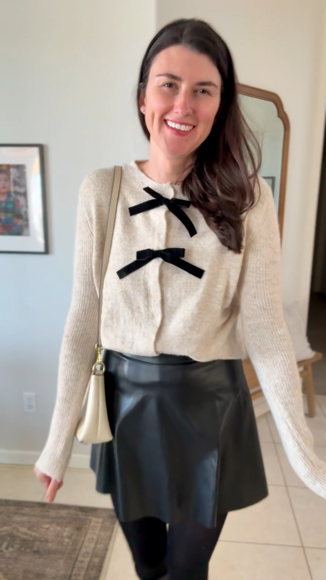 Adorable velvet bow cardigan sweater. So soft and cozy! Paired with  high waist faux leather skater skirt. I am wearing a size large in the sweater and faux leather skirt. I sized up one size.because they both run small. 

#LTKTall #LTKmomlife #LTKHoliday
