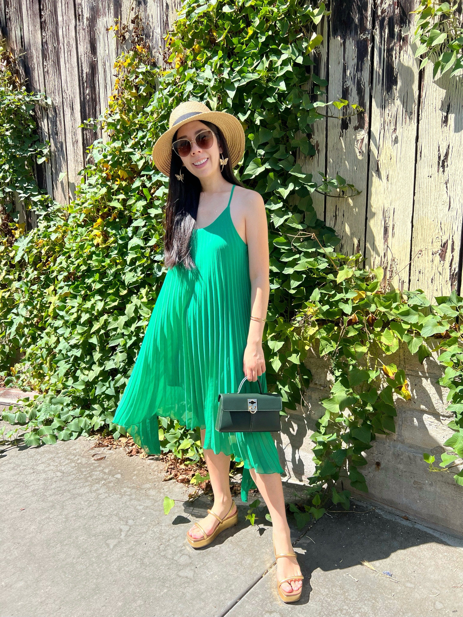 Incorporating more color into my wardrobe even though the first day of Fall is tomorrow! I went to my local farmer’s market today and decided to dress up for the occasion. I wore this asymmetrical shamrock green pleated midi dress with gold platform sandals. I also took my new tiny bag out for a spin! I kept my other accessories minimal with gold butterfly hoop earrings and a panama hat. 

#mididress #summerstyle #fedora  

#LTKSeasonal #LTKFindsUnder100 #LTKStyleTip