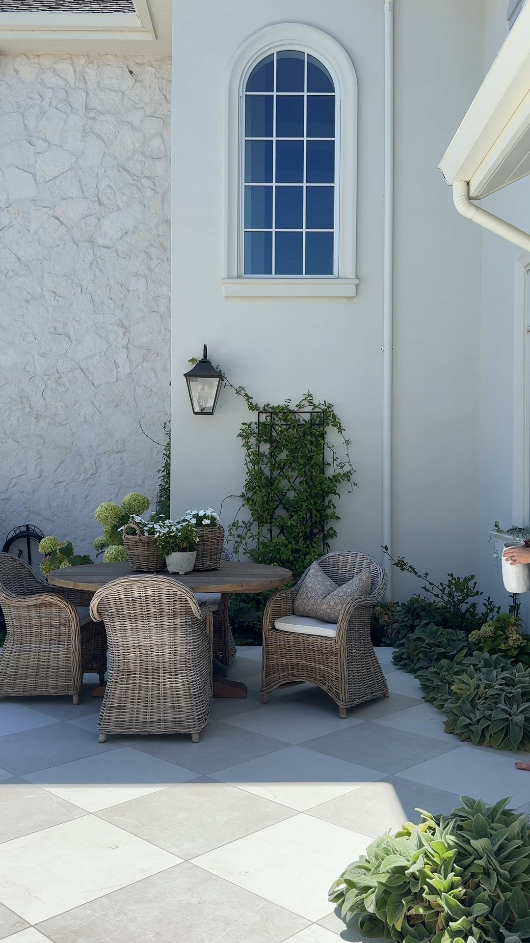 My most asked link is for this tile!  This is Sterlina l and from what I can tell it has been discontinued. They now have Sterlina ll and that is what I used by our outdoor fireplace. It is a slightly warmer silver than the one I used in my laundry room and in our courtyard.  In all the spaces I used matte white  and matte silver. I am linking Sterlina ll.  

This tile is beautiful inside and outside! It doesn’t get hot! However, I don’t know that I would put it by a pool. I think it could get slippery even though it is matte.

I’ve also had these beautiful rattan chairs for three years. They are not outdoor rated and mine have grayed some. I do cover them in the winter, but they are on sale right now! You can’t beat the price and I just love the style! They would also be perfect in a covered patio or a sunroom!  Linking my outdoor lighting and planters too!

#LTKSaleAlert #LTKSummerEdit #LTKHome