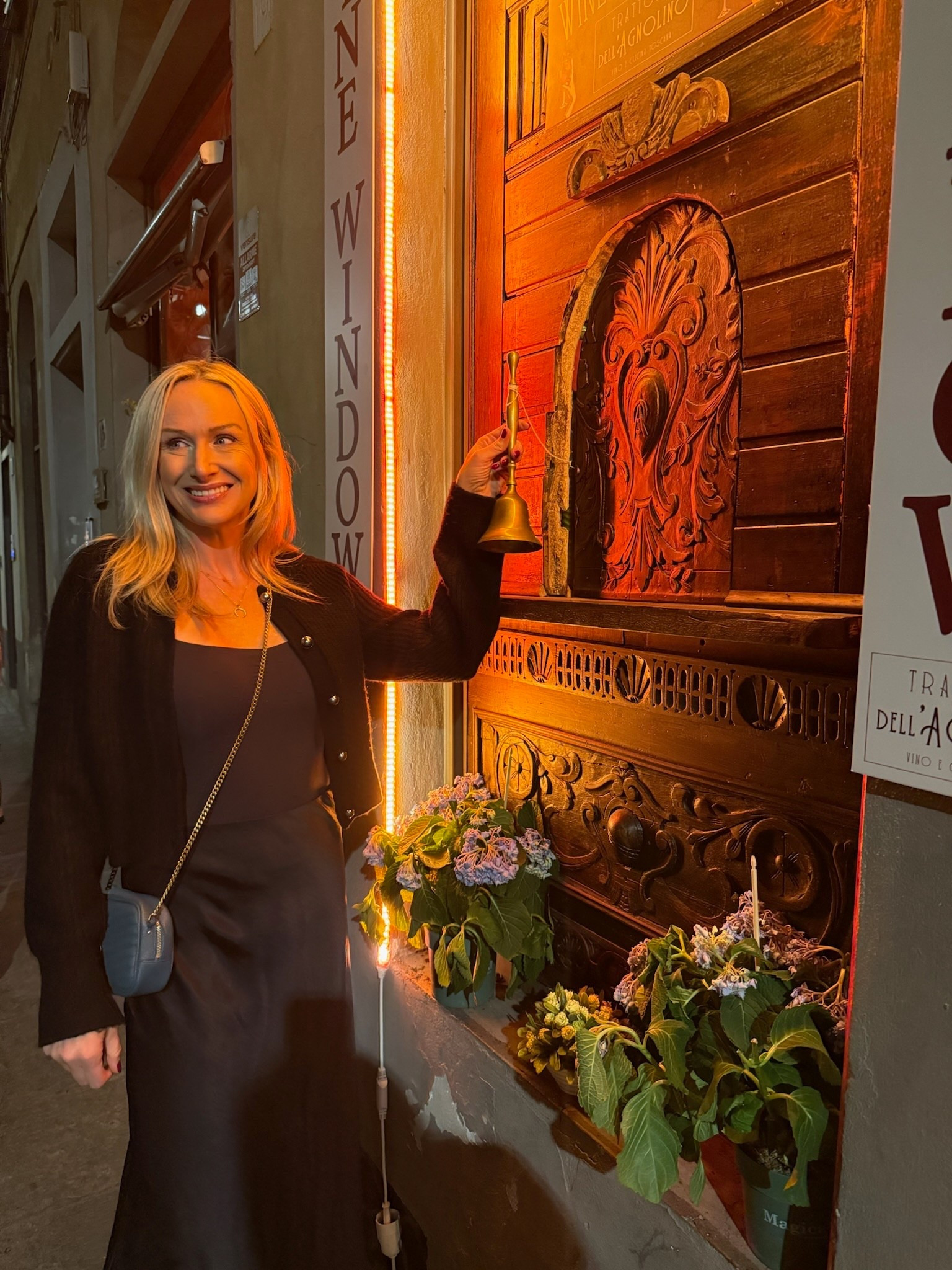 Florence wine window evening outfit. All black with pop of color cross body bag  

Italy travel outfit 
Fall outfit 

#LTKTravel #LTKOver40
