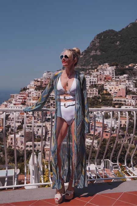 My poolside #ootd in Positano, Italy. This OYE white bikini set is so unique and cool. I love the gold buckle detailing. (Fit runs true to size.) And then this long sleeve coverup is a real show-stopper… It’s a new favorite of mine! 

~Erin xo 