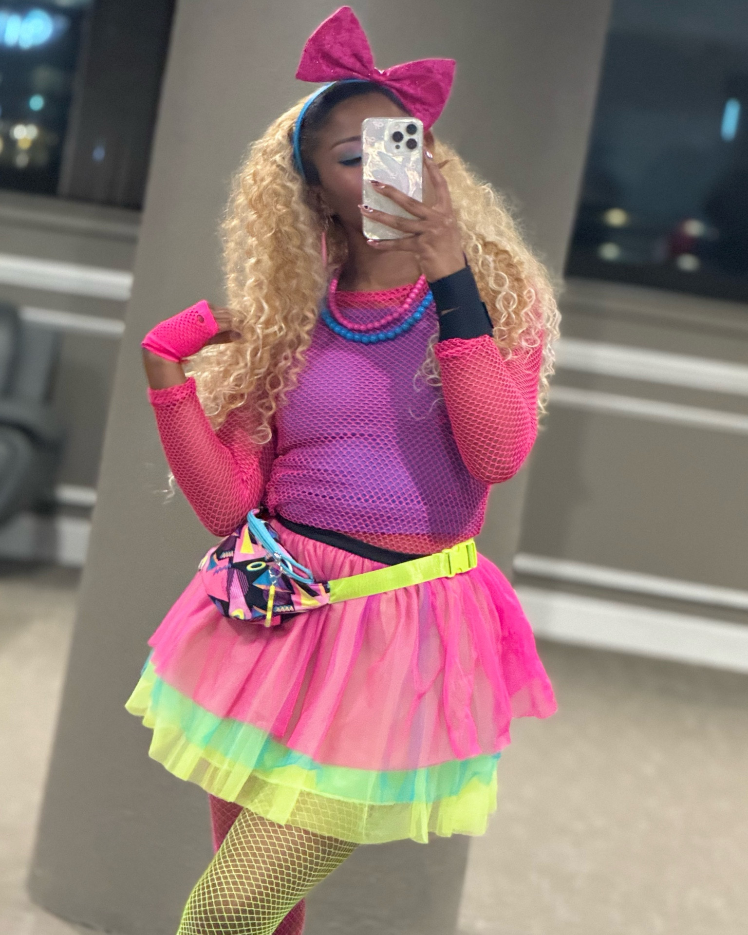 80s/90s Outfit Deets 📻🎉

Spirit Halloween 
- pink fishnet top
- pink & green fishnet tights 
- fanny pack 
- cassette tape earrings 