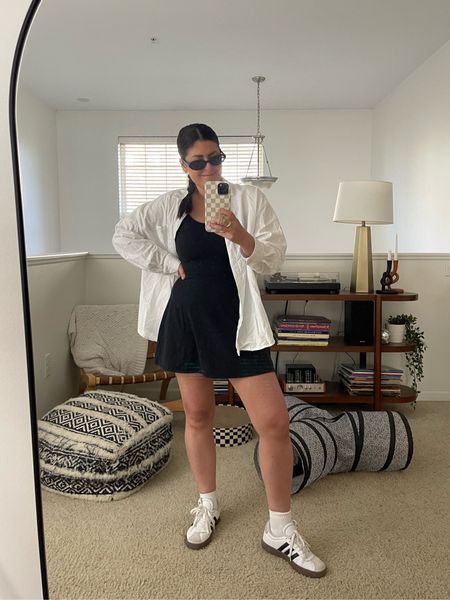 Black mini athletic dress (medium) | white button down (medium) | white socks | adidas sneakers | black sunglasses | gold jewelry

Spring outfit, casual outfit

#LTKstyletip #LTKmidsize #LTKfindsunder100