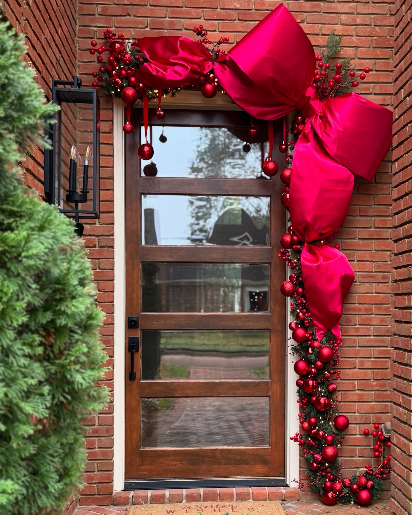 You’ll need 4-6 of the Walmart garlands to fluff and tie side by side

I used 4 strands of these Target lights. The color is so warm and inviting and they will stay on even if one bulb goes out!

The berry sprigs and fabric are from hobby lobby and unlinkable, but I added some similar options. 

The tutorial I followed for the bow is linked in my stories 😊

Not included in the below are wire cutters, scissors, green floral wire, and zip ties to hang the garland. 

Tutorial for the bow can be found in my highlights under “Christmas door” ❤️❤️❤️

Christmas porch decor

#LTKHome #LTKHoliday #LTKSeasonal