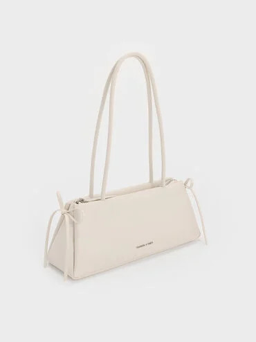 Hazel Bow Elongated Trapeze Shoulder Bag
    
         - Meringue White | Charles & Keith AU