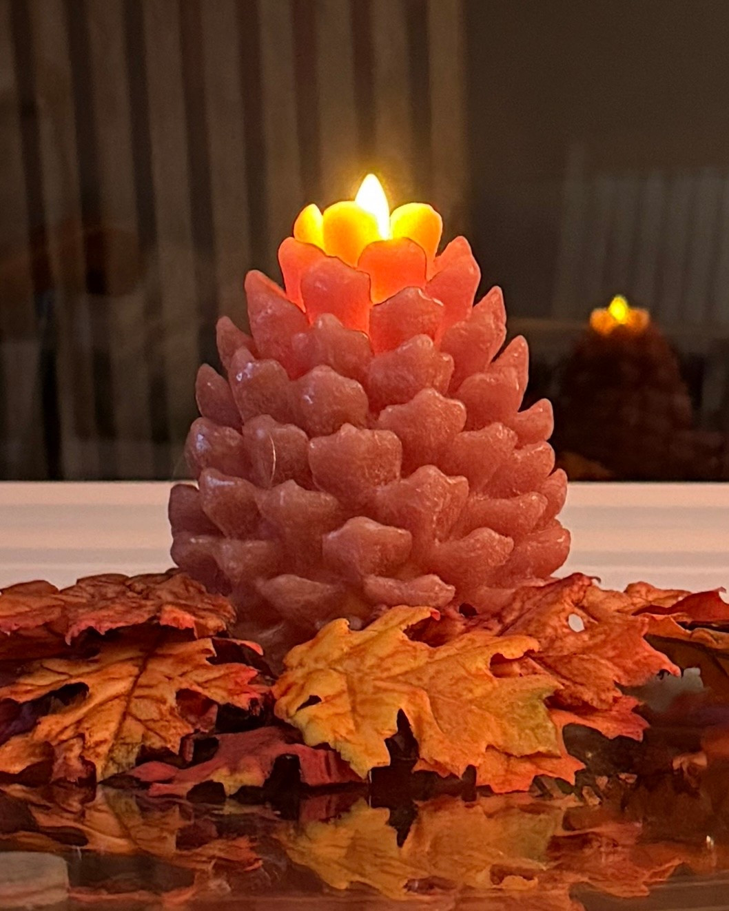luminara pinecone . candle  perfect for fall and thanksgiving - the timer is my favorite feature - 18 hours off- 6 hours on 
use my code for 10% off
fearlessmermaid10
@luminara 

#LTKSeasonal #LTKHome #LTKHoliday