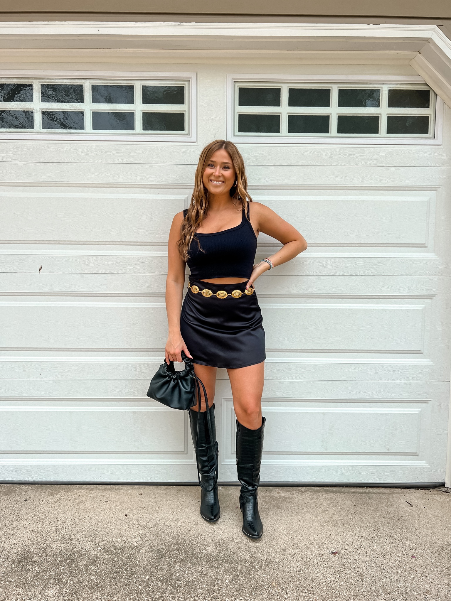 all black outfit idea. black mini skirt. black cowboy boots. gold chain belt  

#LTKunder50 #LTKstyletip #LTKunder100