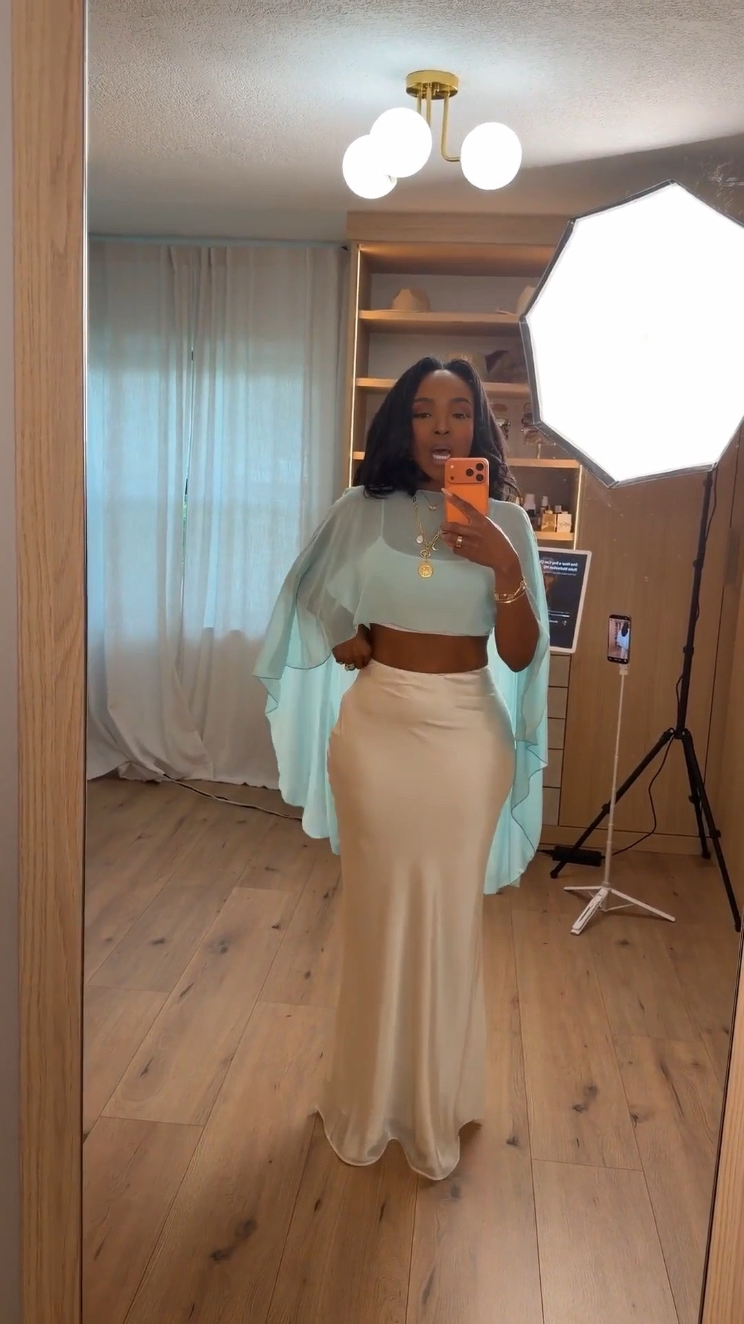 Hi Babes! 

This look feels so soft, feminine, and effortlessly luxe 💙 The airy aqua top paired with the silky cream maxi skirt gives that elevated resort energy that always looks expensive. I love how the flowy sleeves add movement while the fitted waist keeps the silhouette flattering and balanced.

This is the kind of outfit that instantly makes you feel elegant without needing much styling. Just add layered gold jewelry and a chic sandal for the perfect vacation-ready look.

Perfect for:
• Resort vacations  
• Beach dinners  
• Coastal brunch outfits  
• Summer vacation styling  
• Cruise dinner looks  
• Elegant daytime events  

Everything is linked below ✨

xx Kira | IG: KirasFashionFinds

34D - 27 - 40 • Size Small or 4