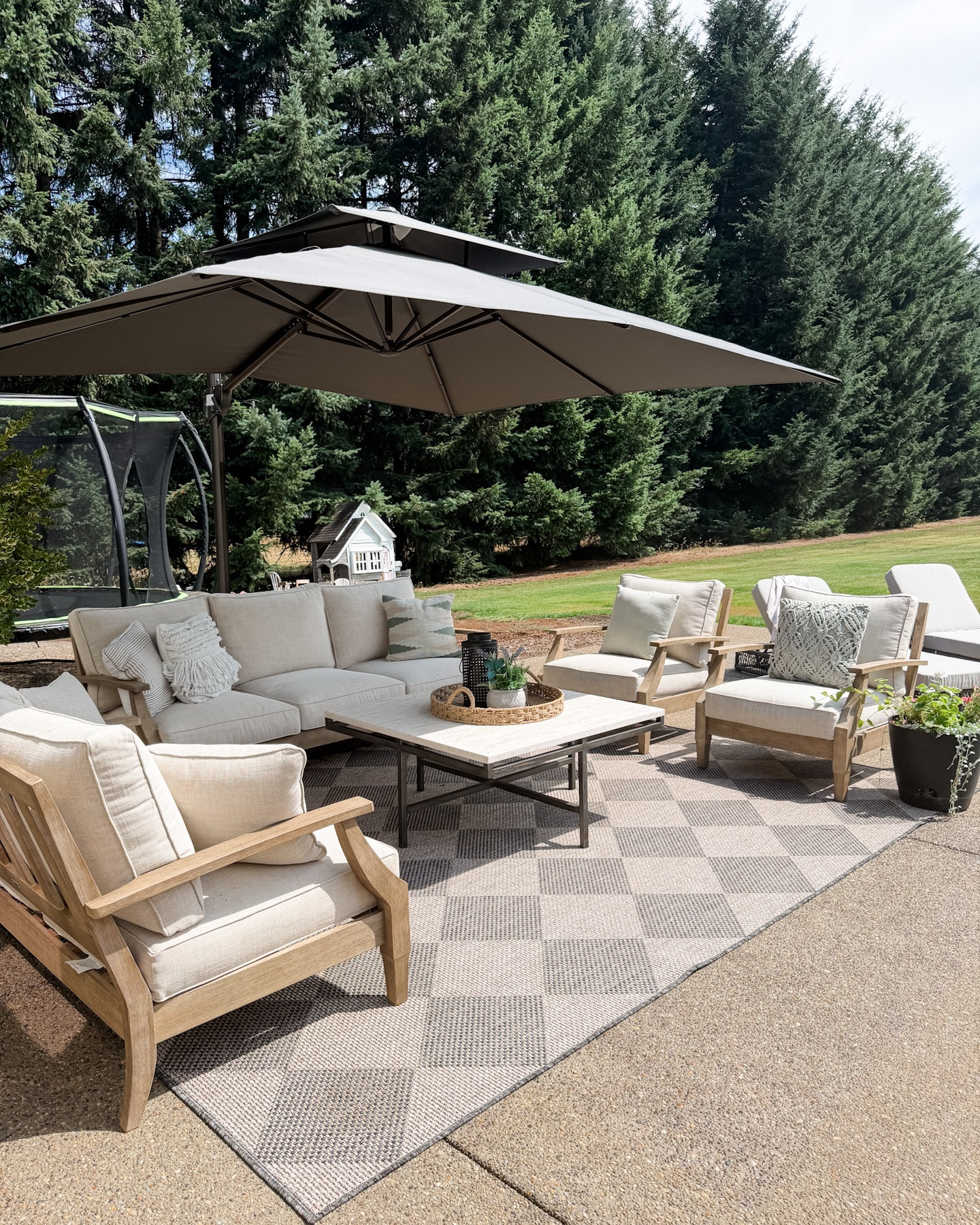 Extended back patio project is complete! Linking our outdoor conversation set, lounge chairs, cantilever umbrella, and rug.

Conversation set: we did the natural / beige color option. We got the full sofa, loveseat and two chairs. 

Lounge chairs: we did the dark grey frame and light grey cushions.

#LTKHome #LTKSaleAlert #LTKSeasonal