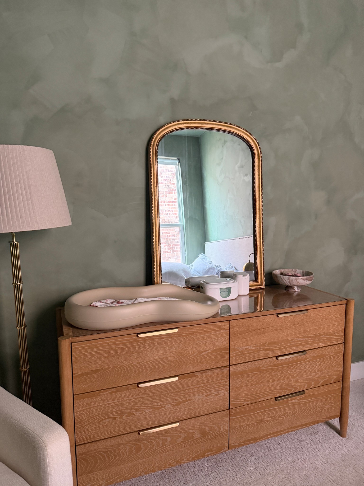 The perfect dresser for less than $2000! Soft close drawers, wood and just stunning. Will complete any room. This is the natural color, NOT rich walnut and there are no filters on this photo. It is more warm in real life. Also love this brass mirror that’s affordable and a great size. 

#LTKHome #LTKBaby #LTKSaleAlert