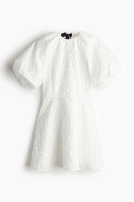 Tie back white puff sleeve dress 

#LTKfindsunder50 #LTKSeasonal #LTKstyletip