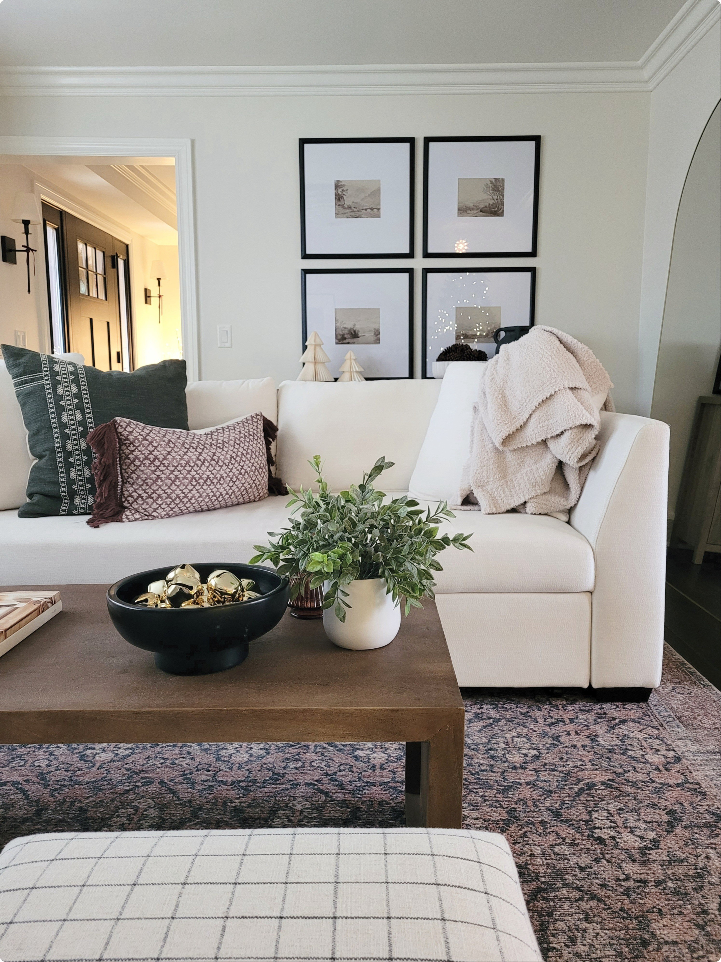 Natural cozy living room with affordable gallery wall,  floor mirror,  and storage cabinet. Small coffee table and vintage inspired rug!

#LTKHome #LTKHoliday #LTKFindsUnder100