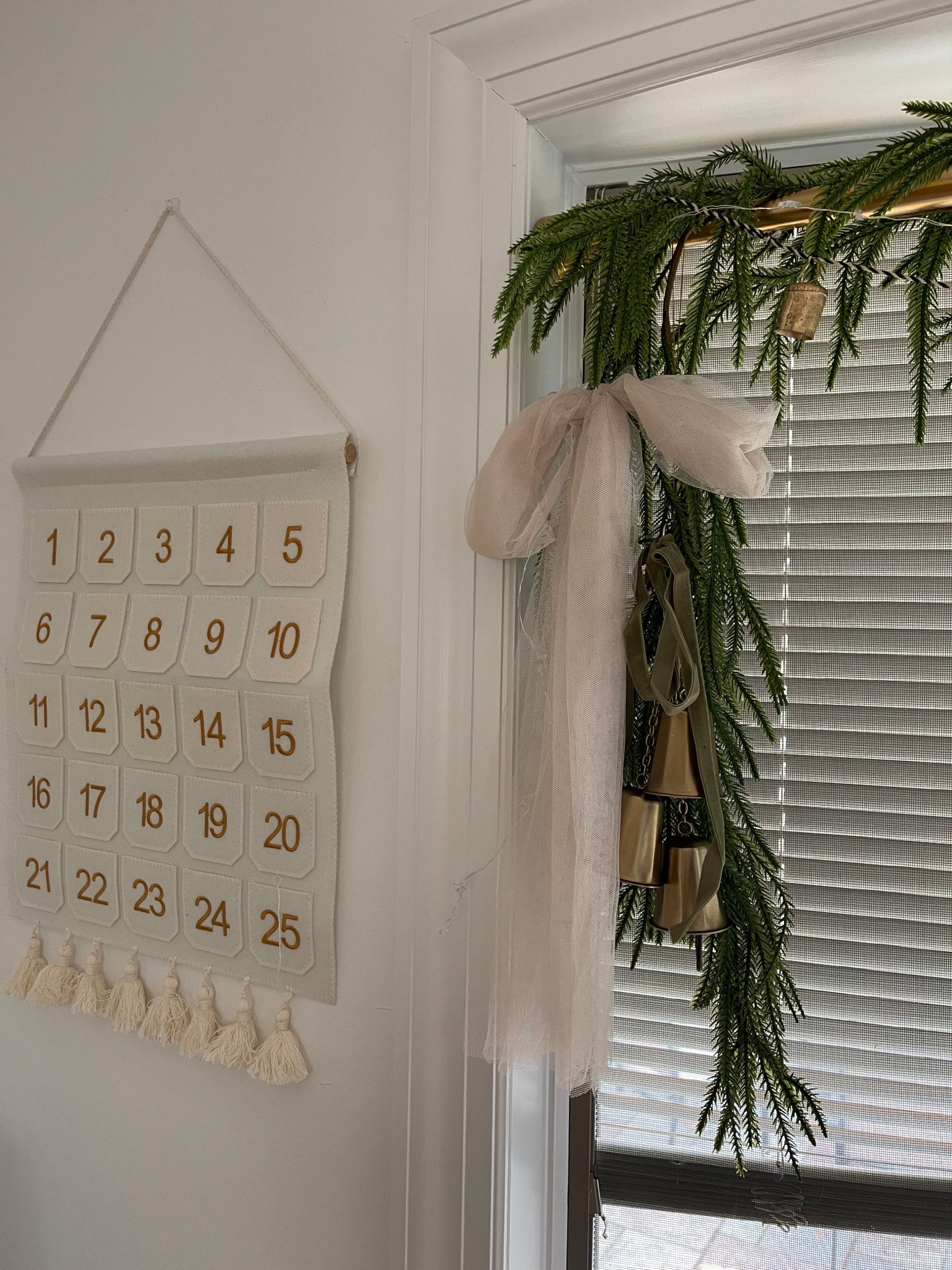 Christmas decorating is nearly finished over here! Here’s where we set up our Polaroid advent calendar, next to our shower rod garland over the windows

#LTKHome #LTKHoliday