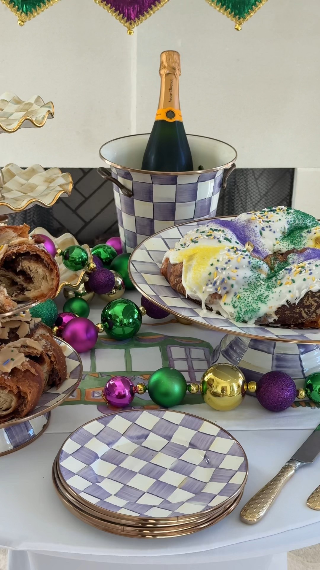 Trust me, you need to throw a king cake party with your friends because you don’t need to live in Louisiana to have a little taste of Mardi Gras! Although, it definitely helps! If you decide to do it, you’re gonna want these beautiful new Mackenzie Childs Violet Check Pieces to display your king cakes. 
I’ve been hosting parties with @MackenzieChilds pieces for the past decade because I love how they instantly elevate your tablescape and brighten the whole room with color. 
This new Violet Check collection is perfect for Mardi Gras plus I know it will transition beautifully into spring.

As for the king cake party, get your friends together and order a bunch of different cakes —most places even ship! Then decorate your house with some festive decor and label each cake accordingly for everyone to try. Once everyone tries the different king cakes, ask them vote on their favorite ones and you can come up with all different types of categories! Also, you have to serve Louisiana staples like fried chicken, jambalaya or gumbo and daiquiris. 
 #mcpartner

#LTKHome #LTKfoodie #LTKvlog